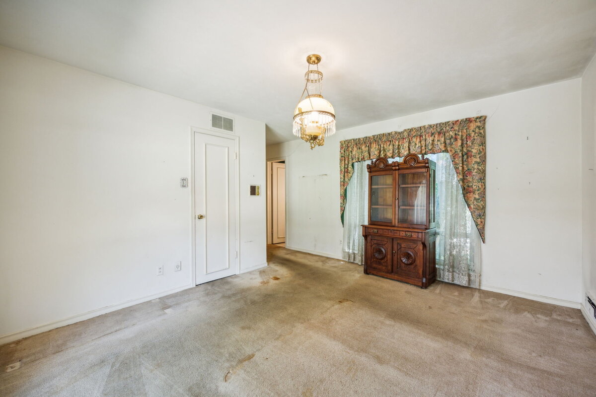14214_edgecrest_dr_dallas_tx_front_bedroom_china_cabinet_-vintage_light_fixture_and_large_window_view-_haven_realty_group