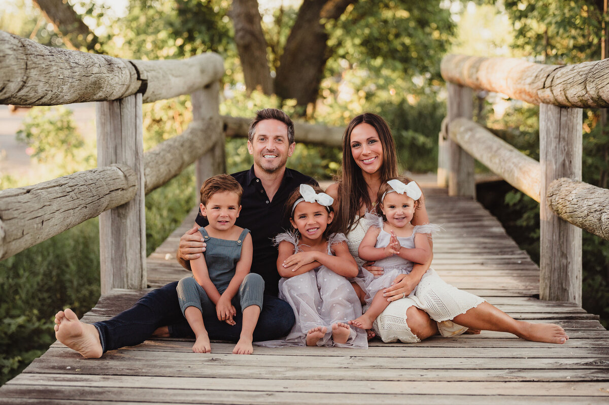 Phoenix family photography on a wood bridge