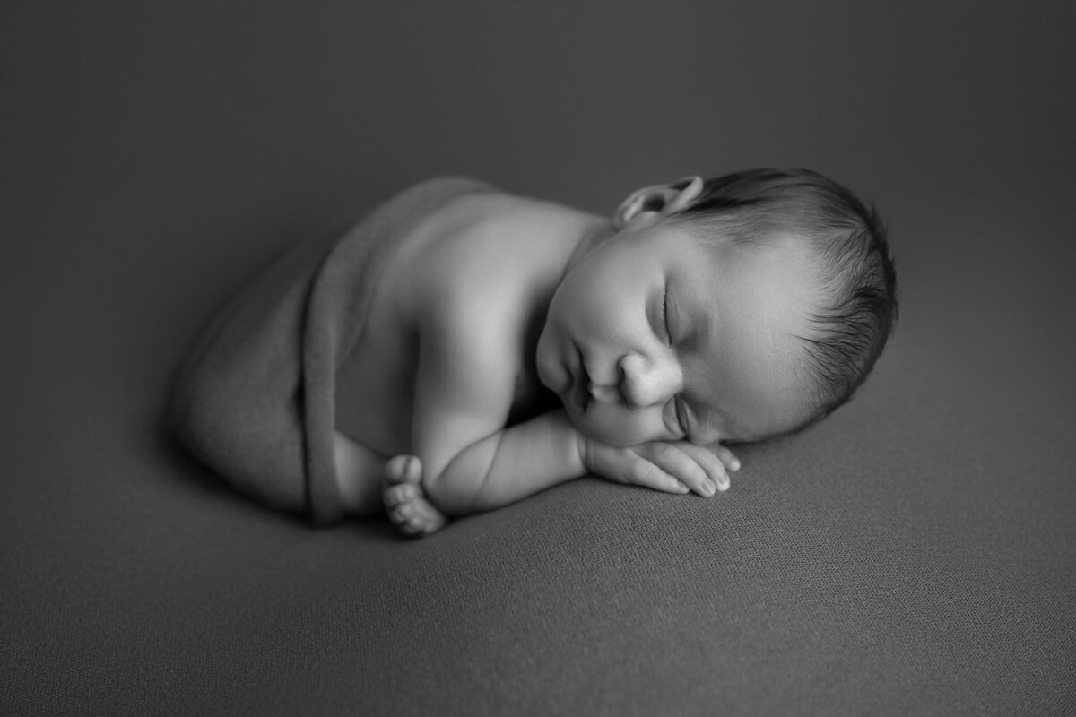 Black white newborn sleeping pose minimalist Austin professional photographer