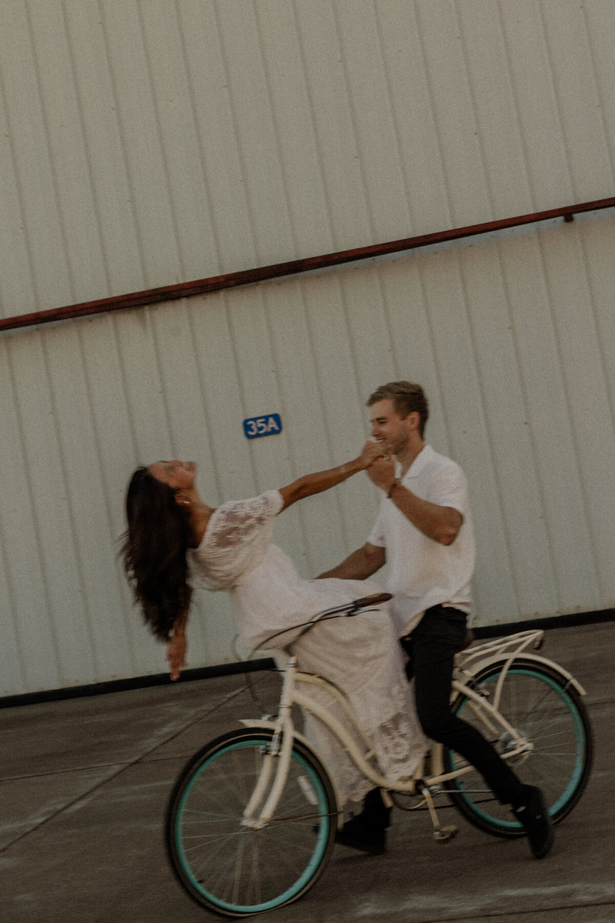 Couple Riding on a vintage bike for their engagement photos 