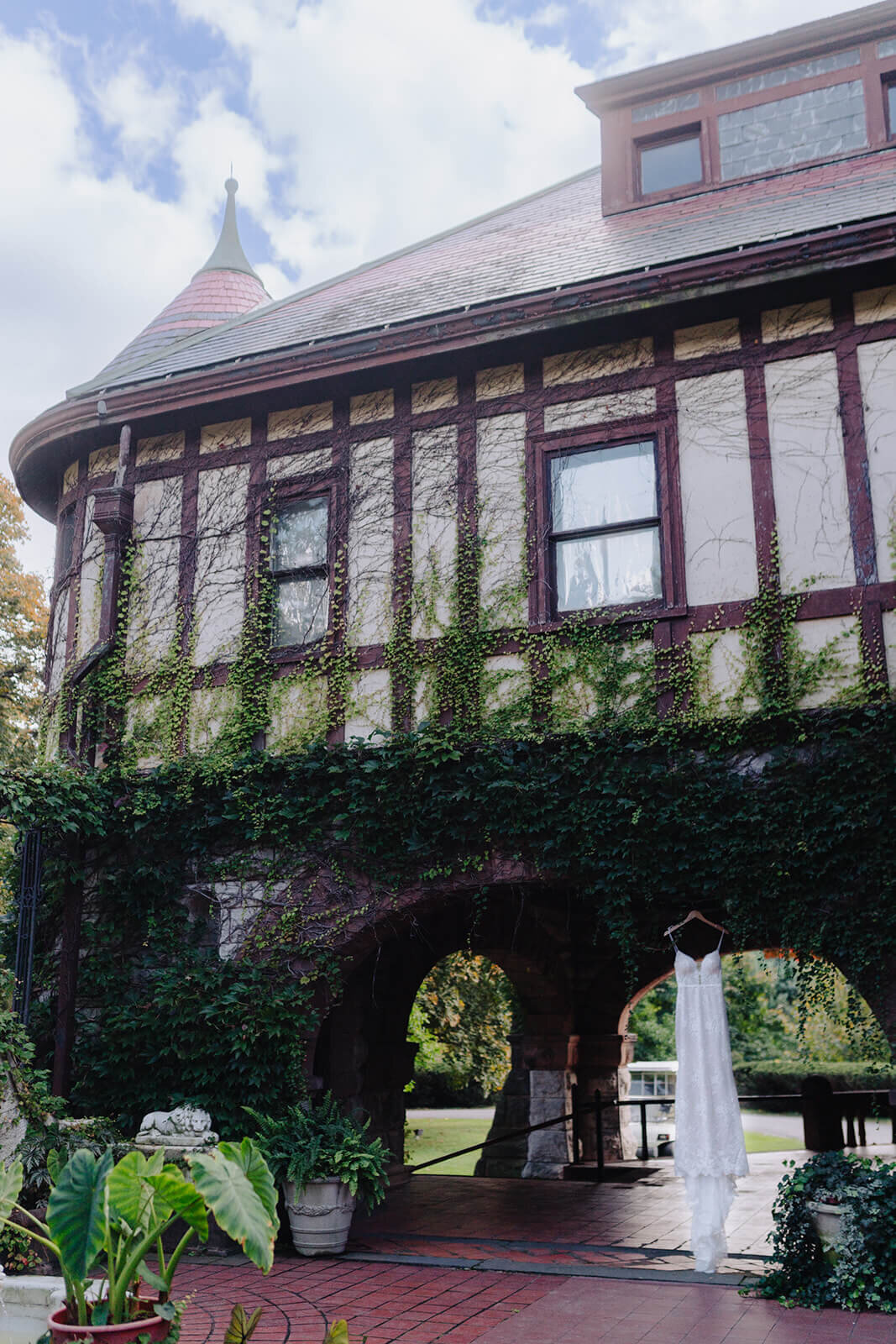 wedding dress hanging from old  building in Finger Lakes, New York
