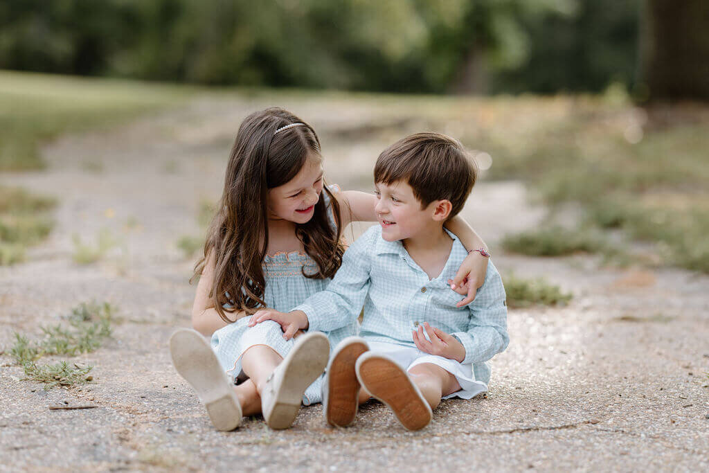Cute candid moment between 2 siblings