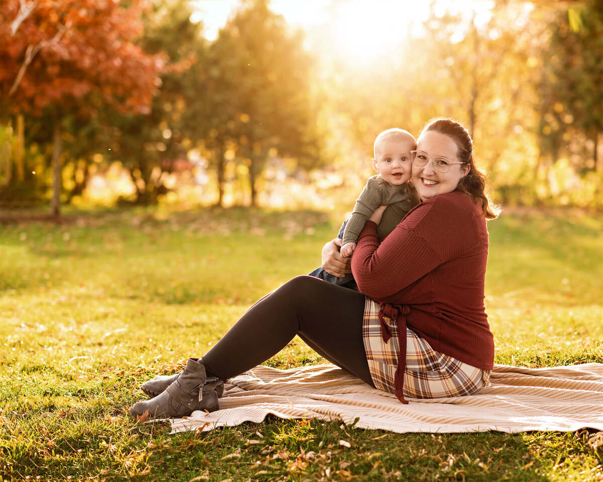 Golden hour outdoor fall portrait of mother and baby | Centennial Park in Ayr, Ontario family photographer