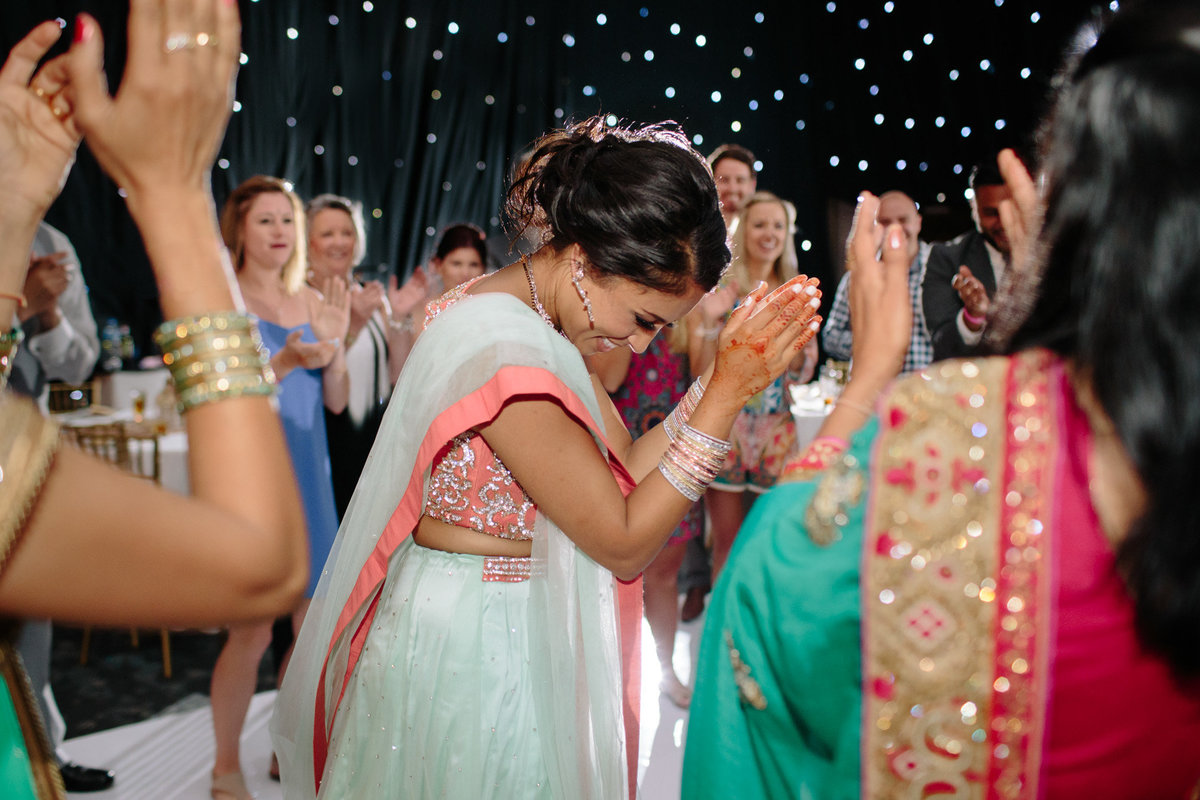 Girls just want to have fun!  This bride is looking gorgeous at the end of her destination wedding.  Photo by Rebecca Cerasani.