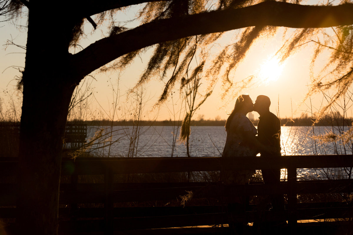 Breannah and Drew at sunset during their engagement session in Spanish Fort, Alabama.