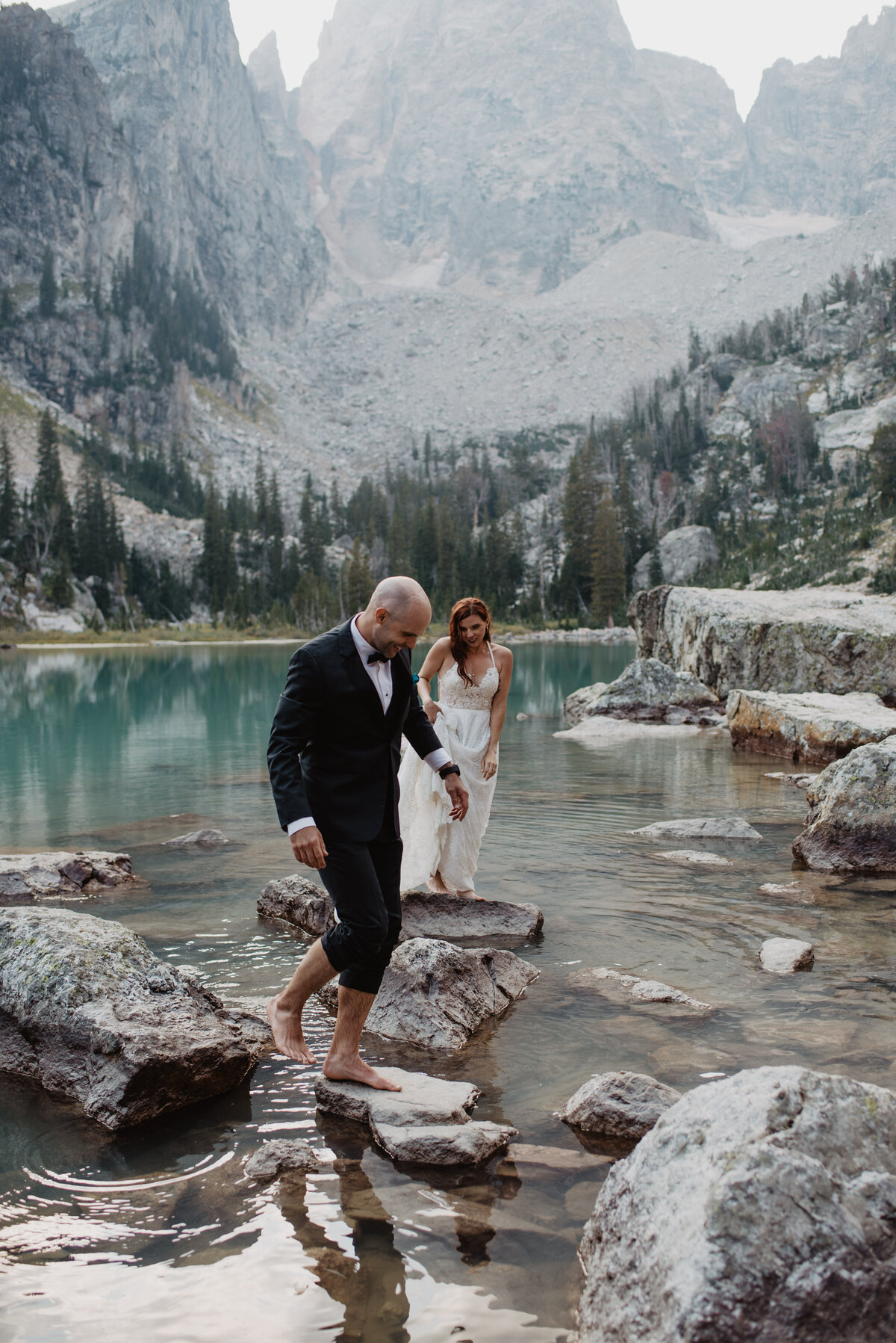 Jackson Hole Photographers capture groom walking with rolled up pant legs