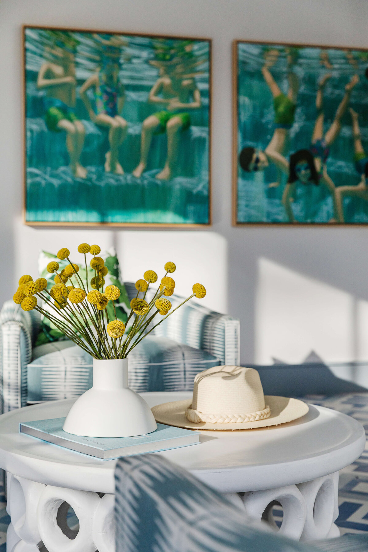 oyster creek studios memorial new build underwater artwork on wall in living room with  white ceramic coffee table and cowboy hat