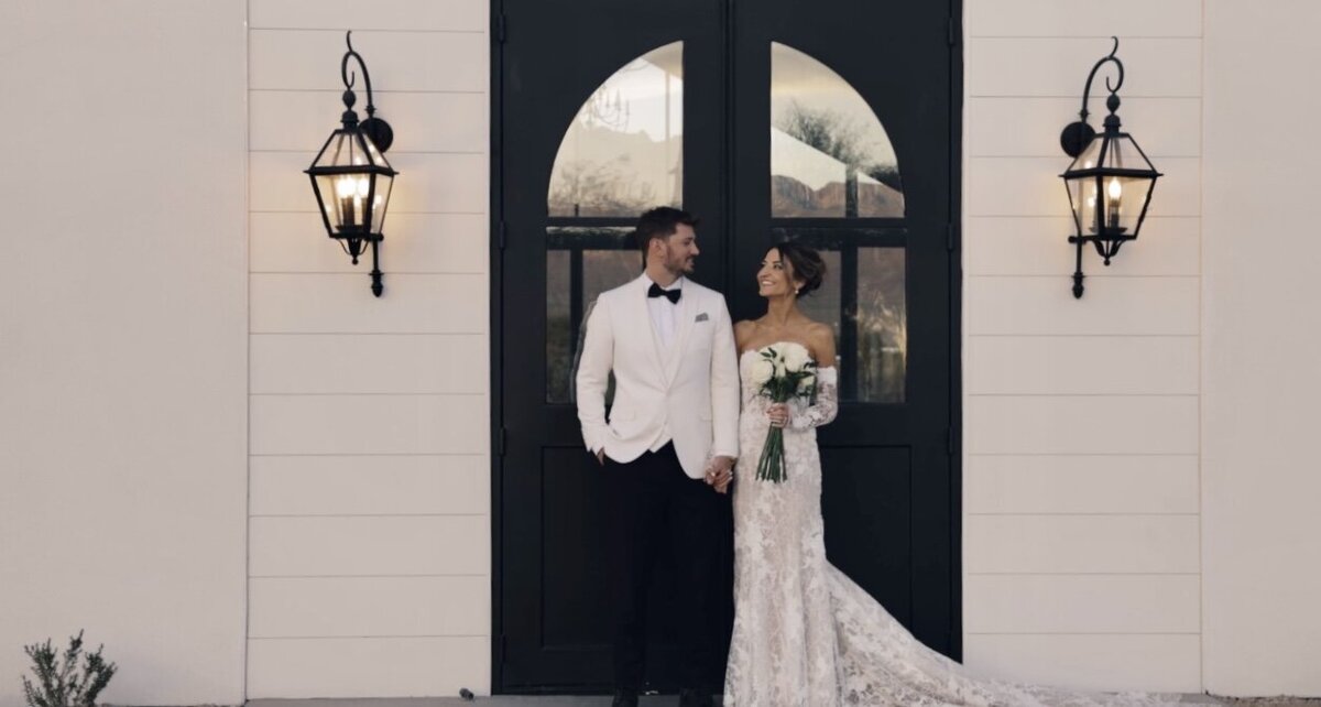 still from california wedding video of bride and groom in field