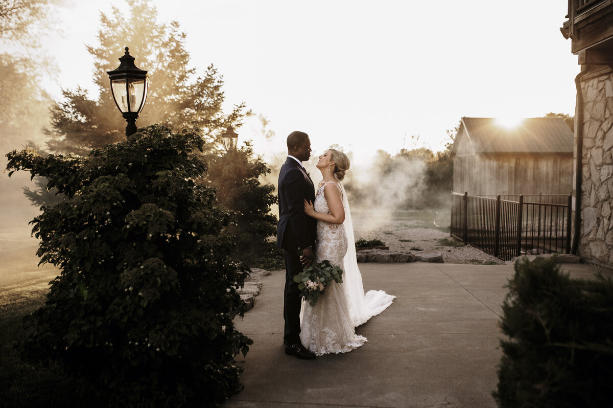 Bride and groom in smoke portrait