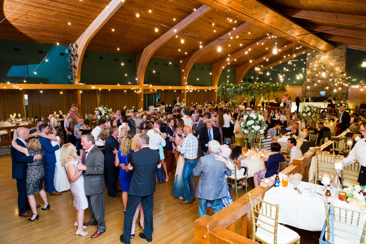 guests dancing the night away during wedding reception in glessner audtorium at wilson lodge oglebay resort