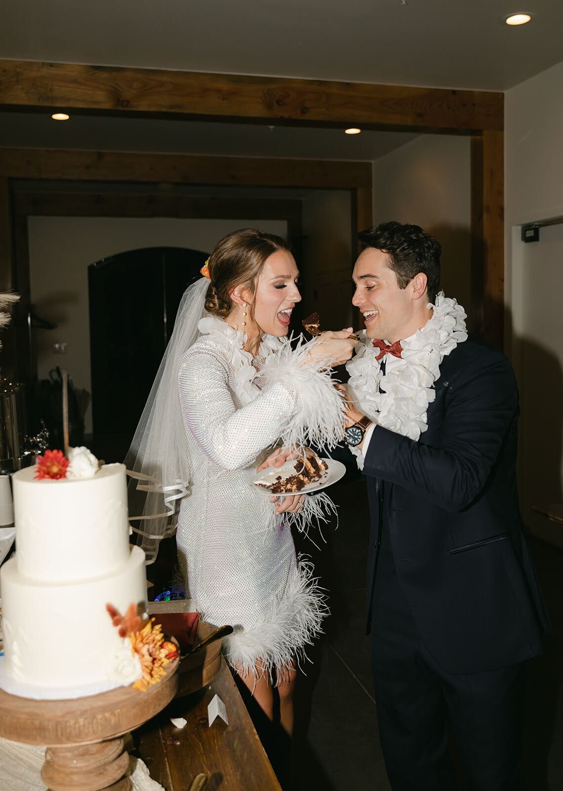 Bride and Groom sharing a first bite of cake at North Star Gatherings.