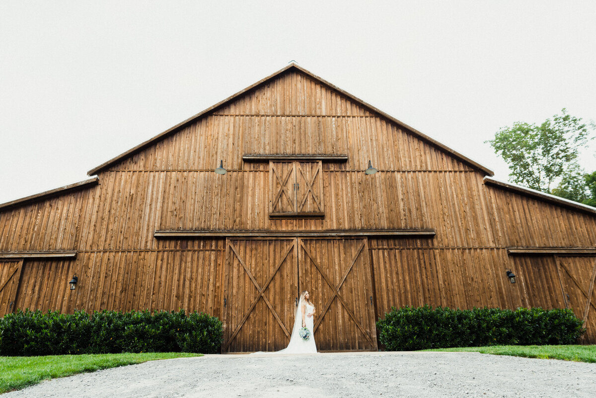 Bride outside barn  Saddle Woods Farm