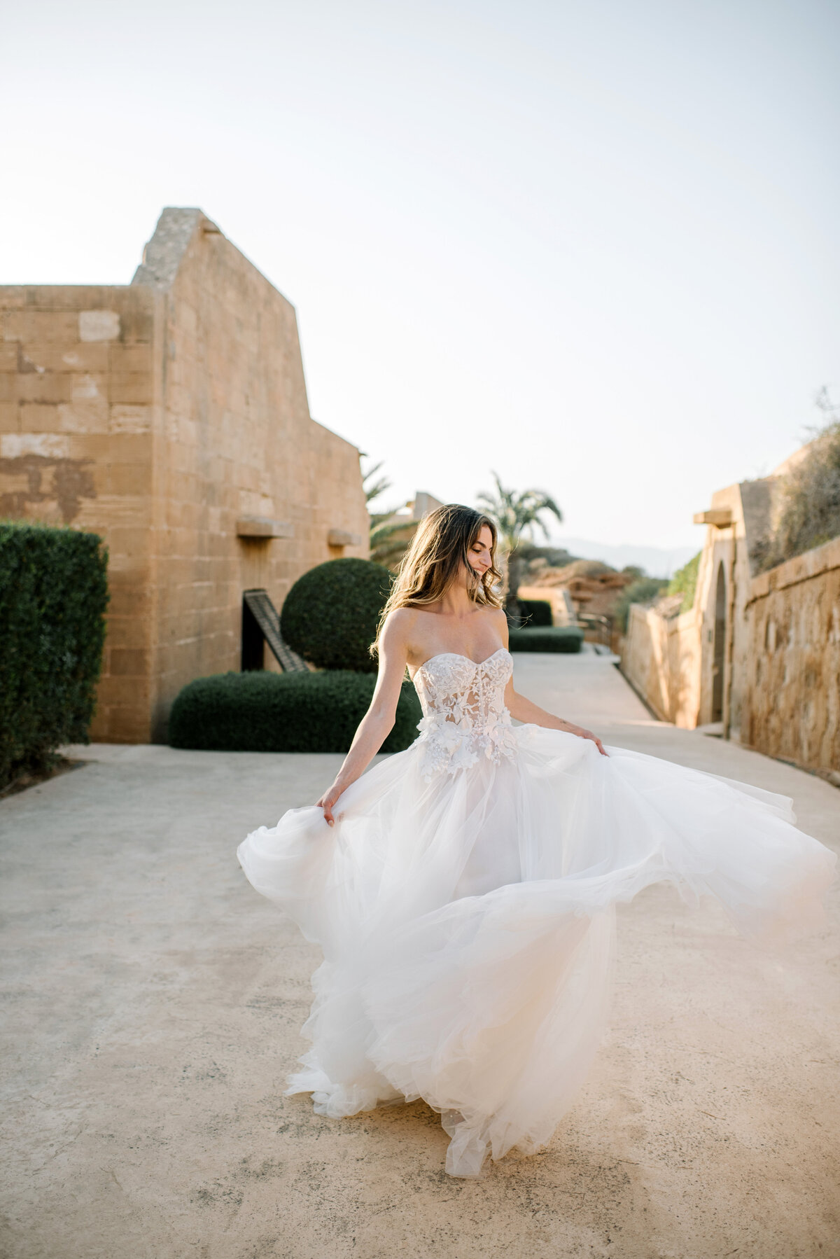 bride dancing in muse by berta dress at cap rocat in mallorca
