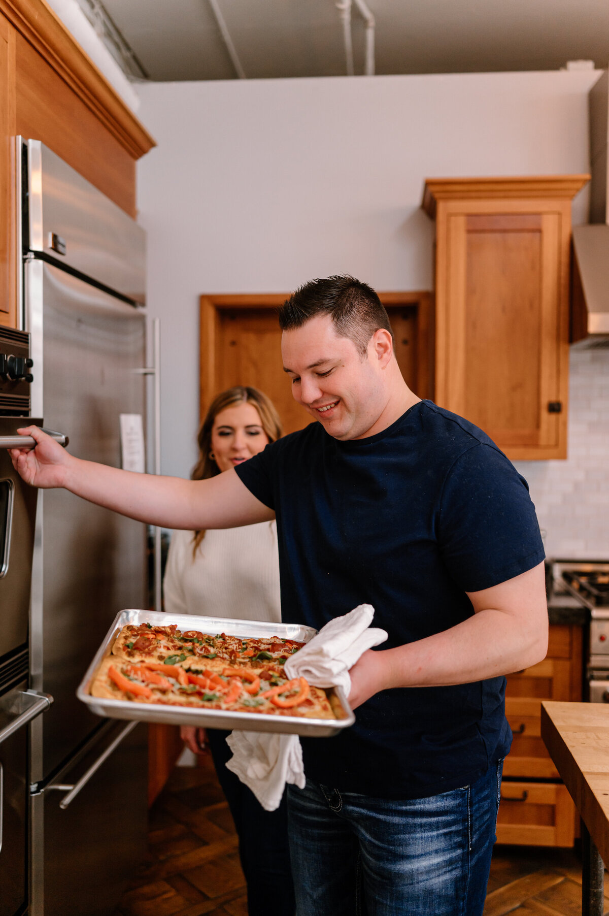 couple making pizza