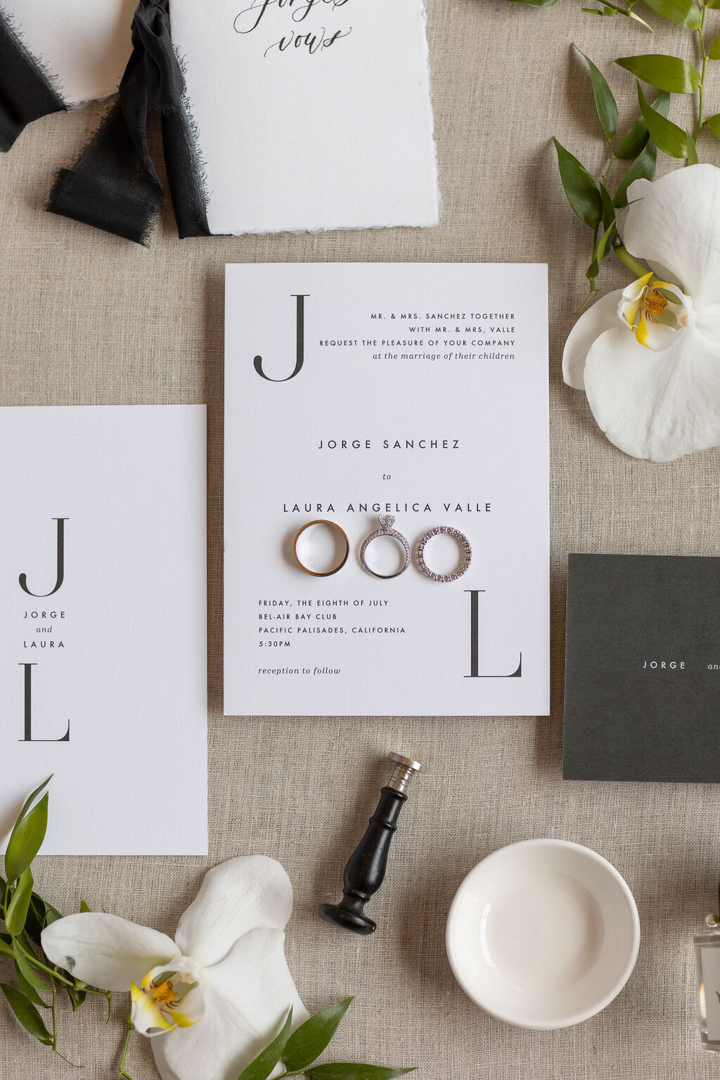 Flat lay of an invitation with orchids