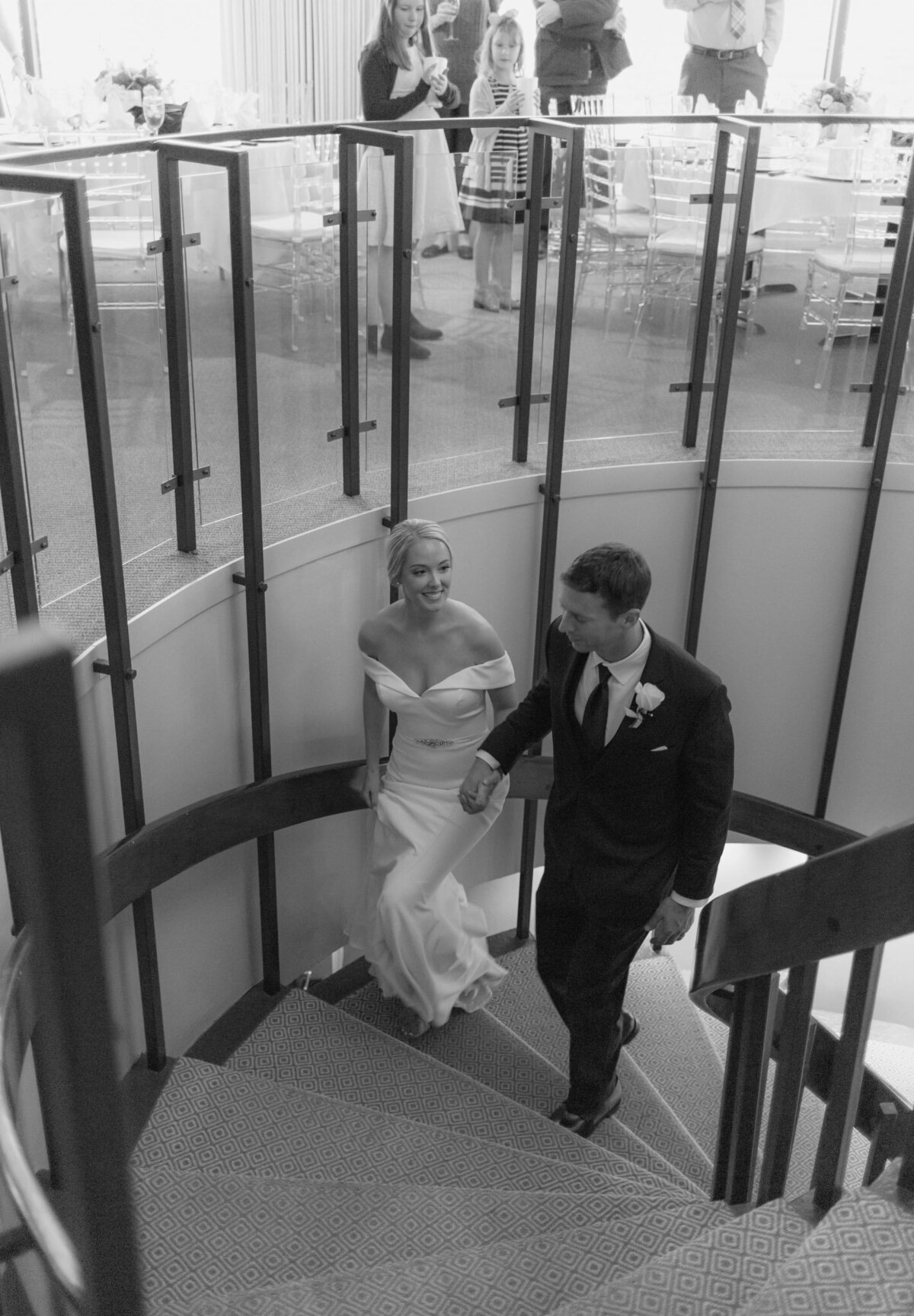 bride and groom walking up staircase at amarillo club
