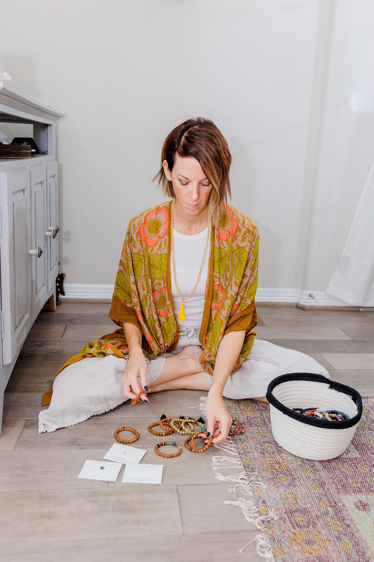 Lady in orange sitting on floor