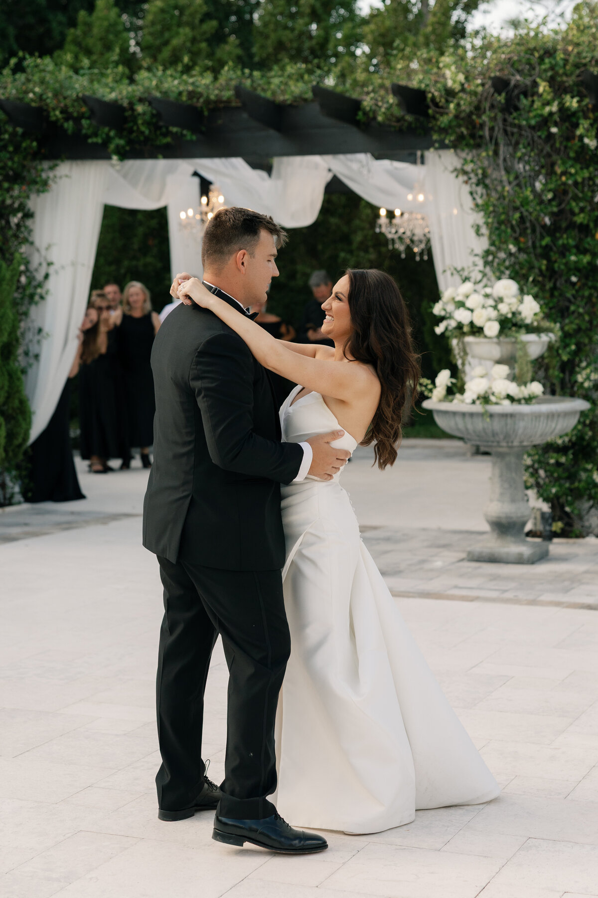 Bride and groom dancing during outdoor reception at La Casa Toscana 
