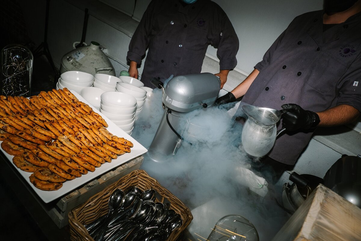 Footers Catering setting up their ice cream sandwich station at the wedding reception.