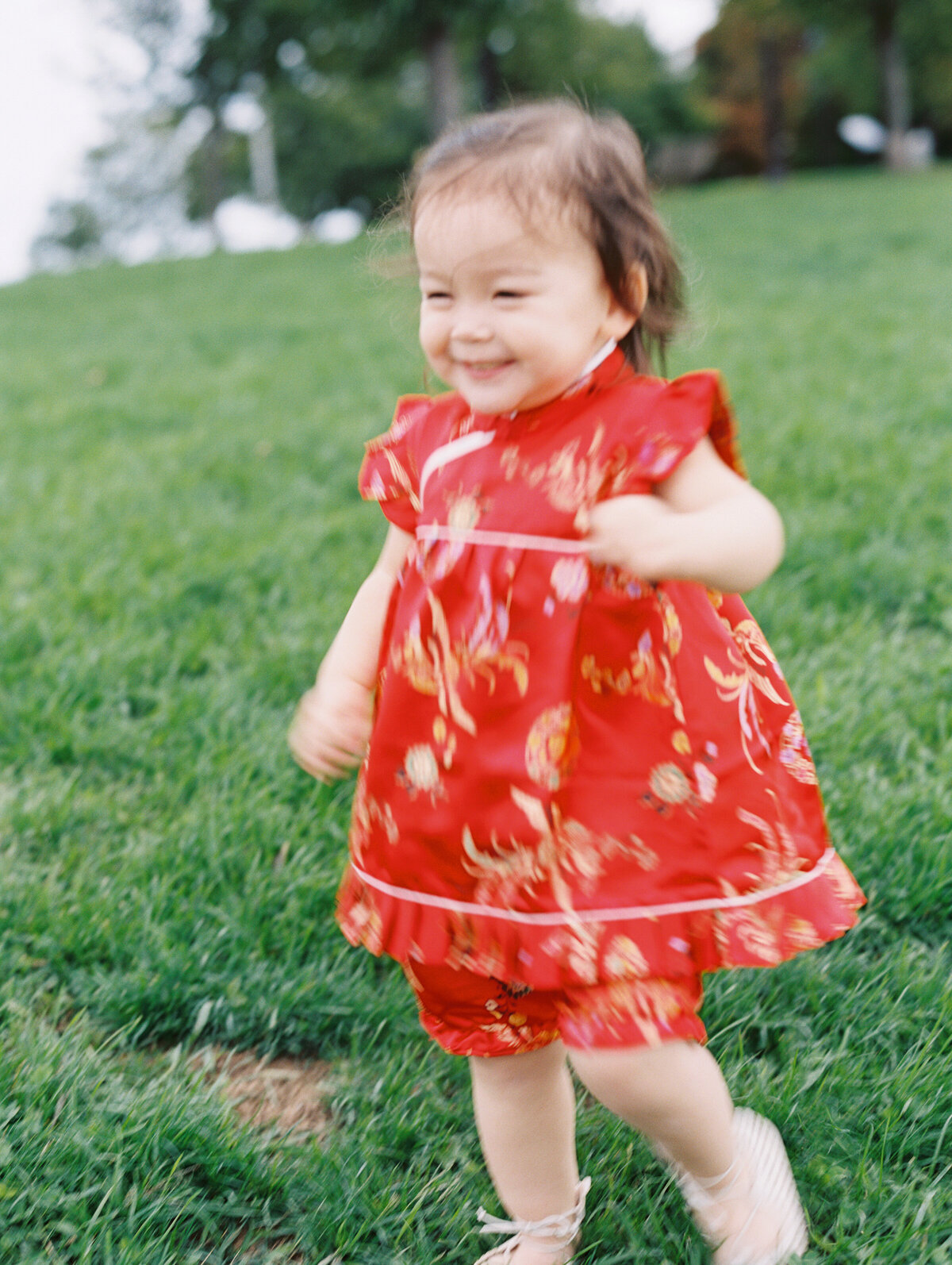 little girl running in red dress at new hampshire family session
