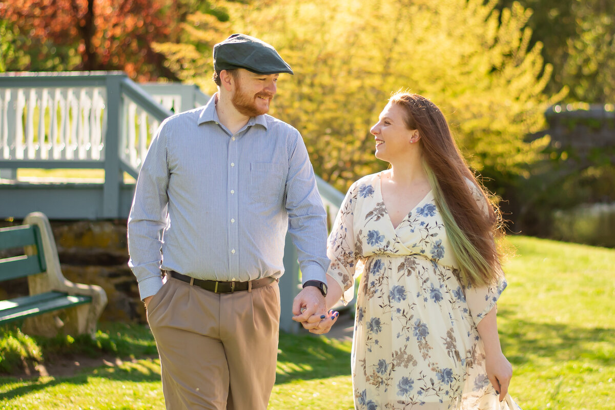 Discover the charm of love in downtown Milford, Connecticut, as this couple strolls hand in hand through the bustling city streets.