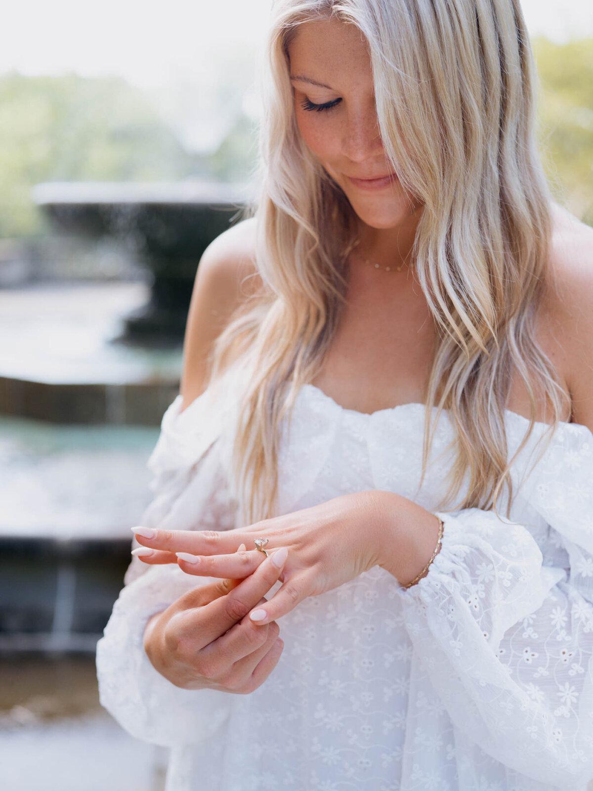 Bride admiring her engagement ring in Charleston, SC.