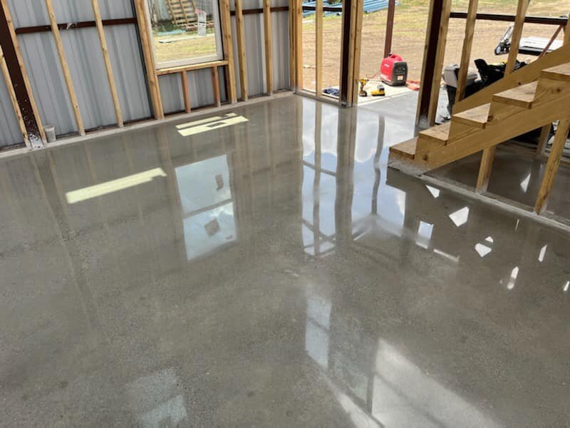 Best Residential Concrete Polishing DFW showcasing a professionally polished concrete floor in a Dallas home, reflecting high-quality craftsmanship and durable finish