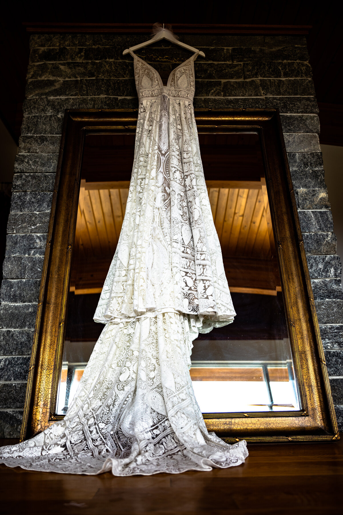 A Wedding dress hanging at  Saltwater Farm Vineyard.