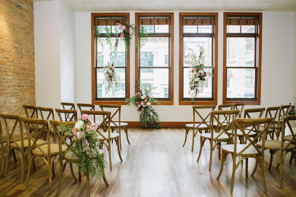 Classic and elegant indoor ceremony at The Garret, historical and sophisticated, Calgary, Alberta wedding venue, featured on the Brontë Bride Vendor Guide.