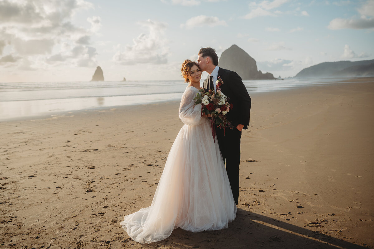Gorgeoud bride and groom on Canon Beach in Oregon for sunset photos