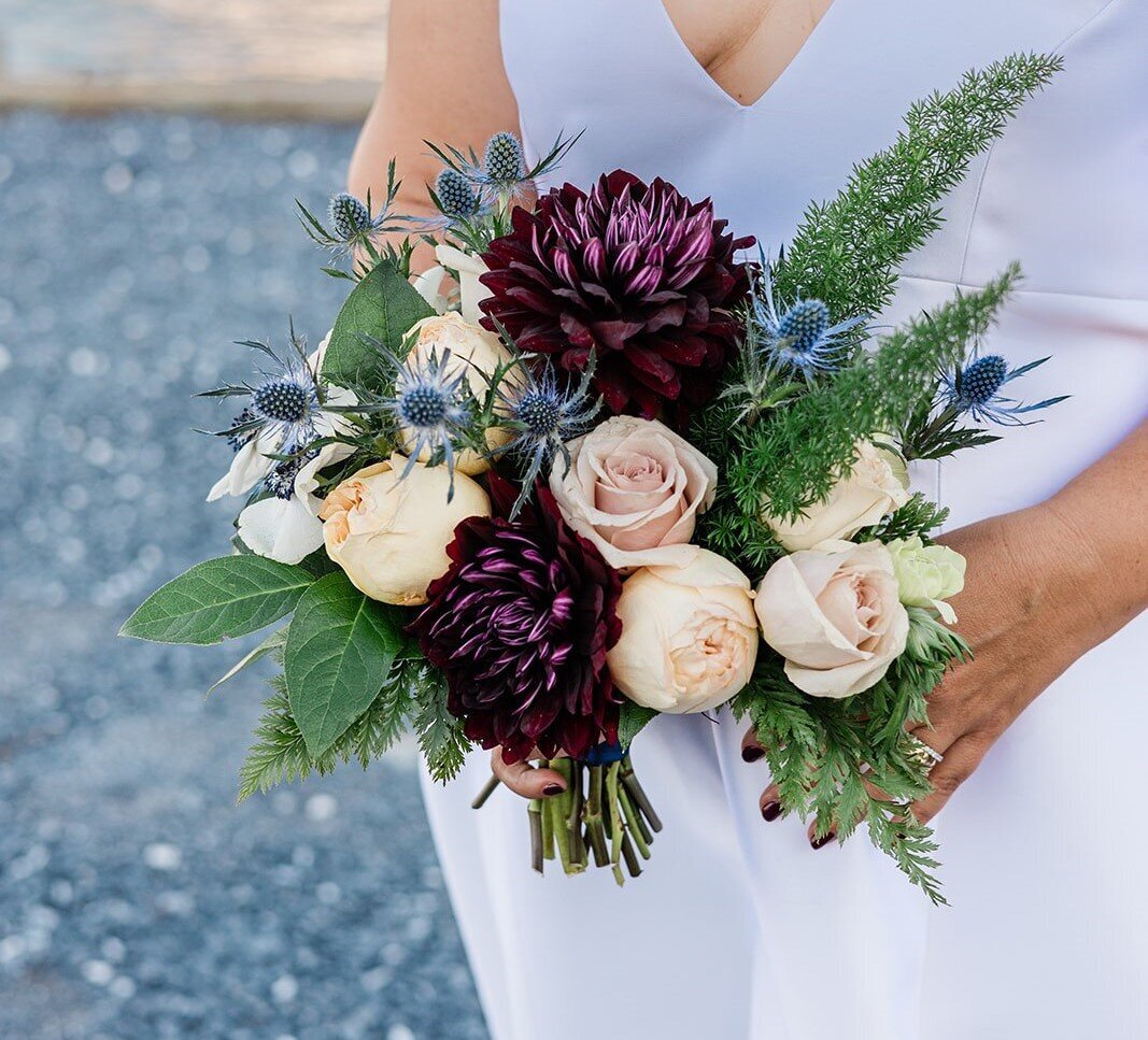 Artistic floral design for a wedding at Miles River Yacht Club in St. Michaels, MD. Garden style bridal bouquets for Eastern Shore wedding venues.