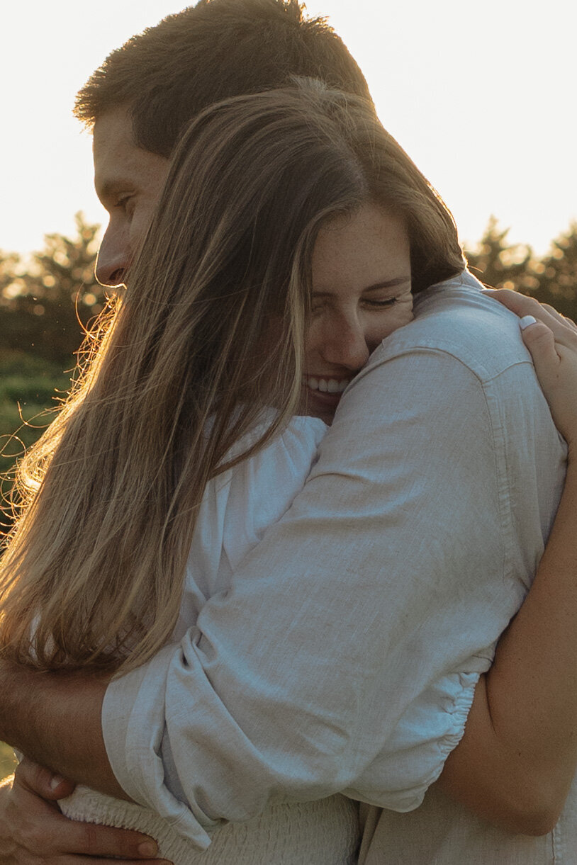 Sunlit picnic moment during a couples session in a vibrant tropical winery setting

