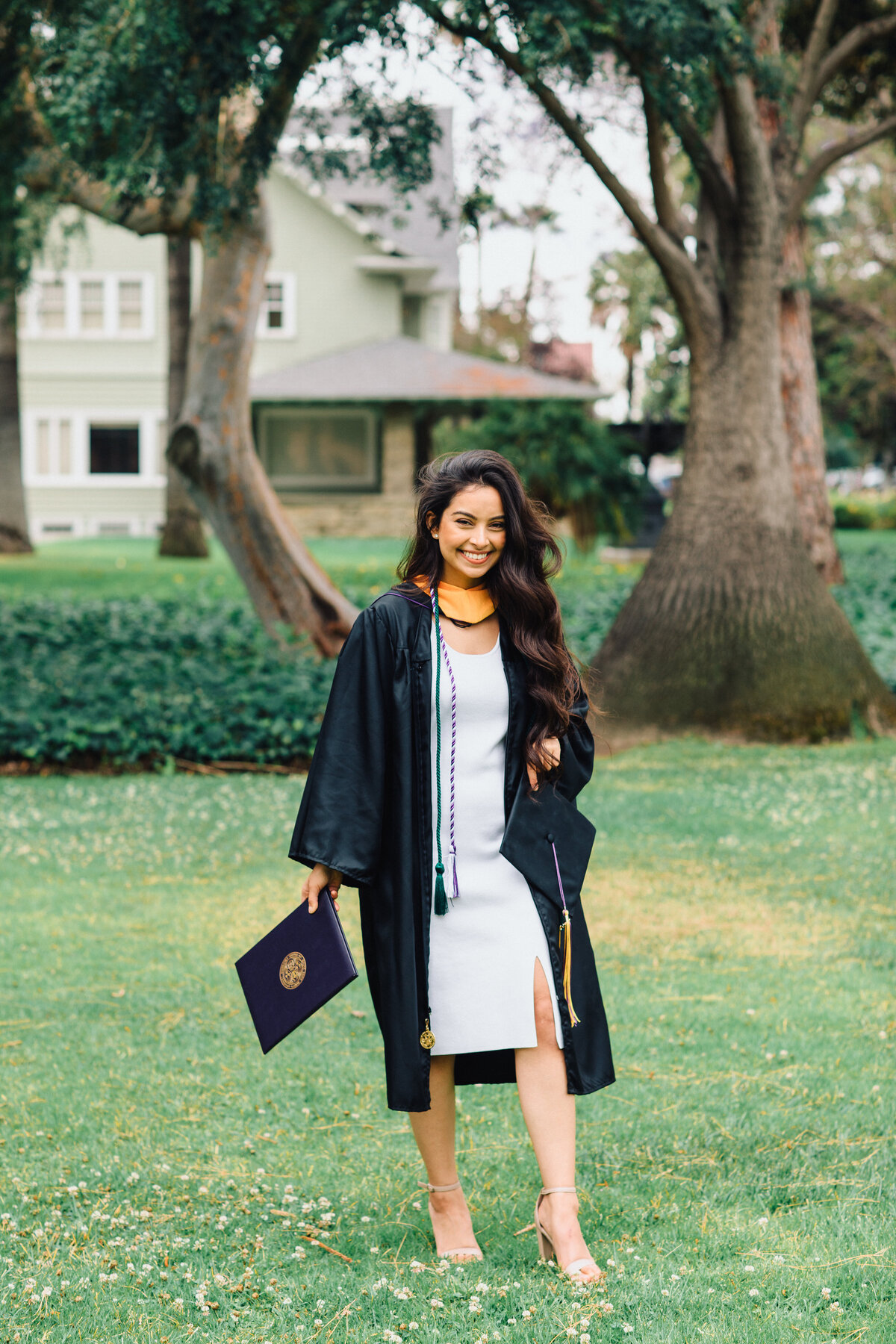 Graduation Portrait Of Young Woman In White Dress Los Angeles