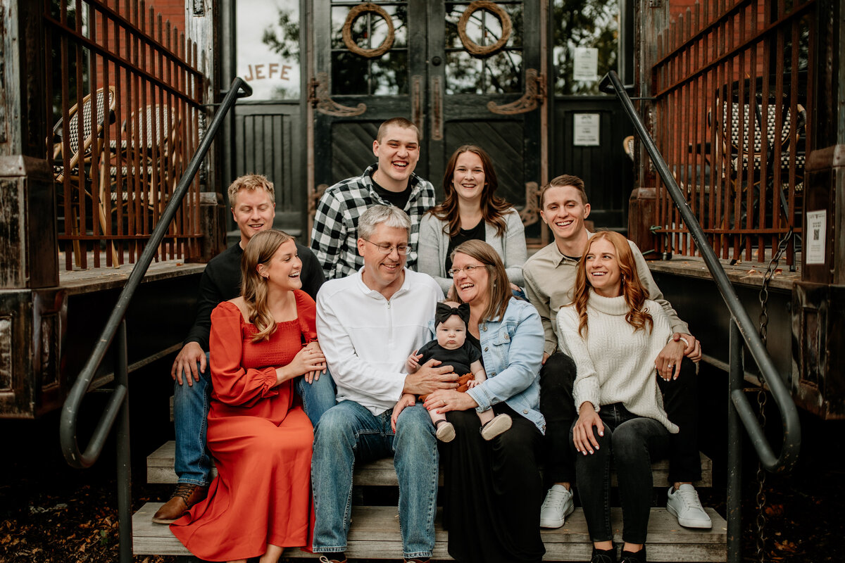 A family of 9 gathers in downtown St. Paul for Christmas card photos.