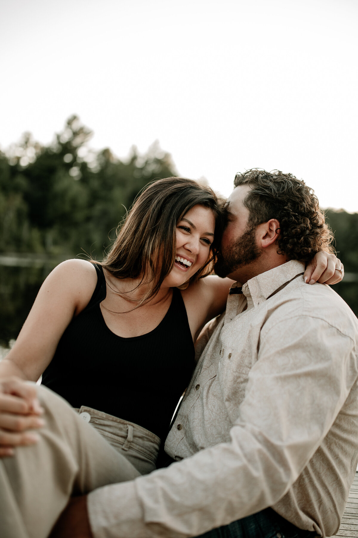 Summer evening engagement photos on a boat
