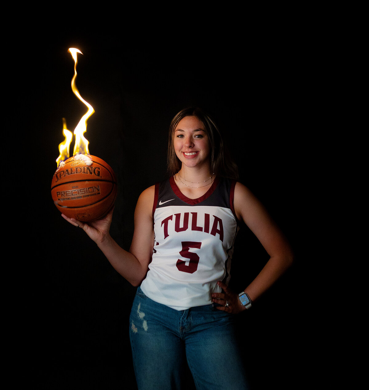 In studio session with high school varsity basketball player while the ball is on fire.