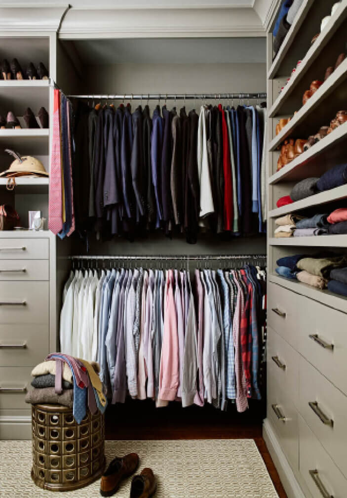 Interior Design Services in Boston feature custom closet cabinets painted light grey for a primary bedroom suite in a brownstone interior design project.