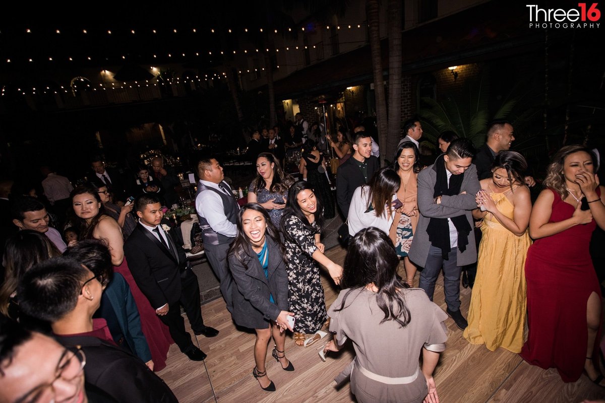 Wedding guests dancing during the reception