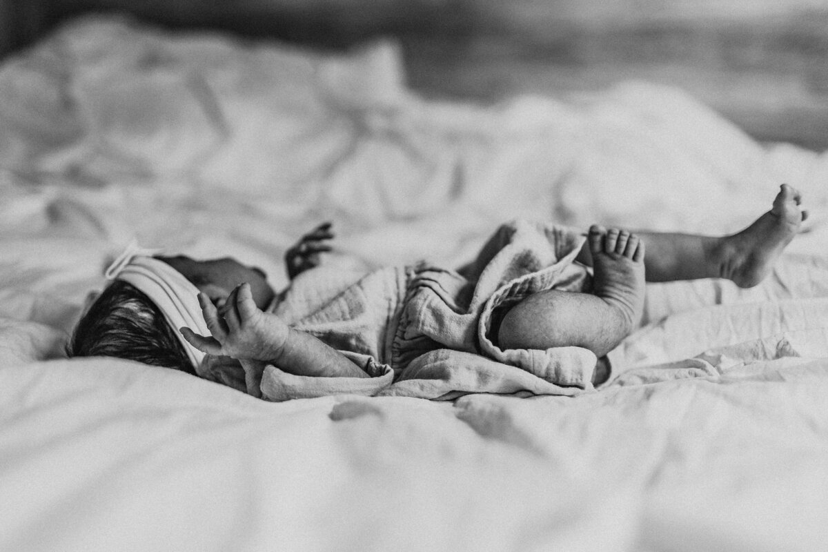 newborn baby unfurling