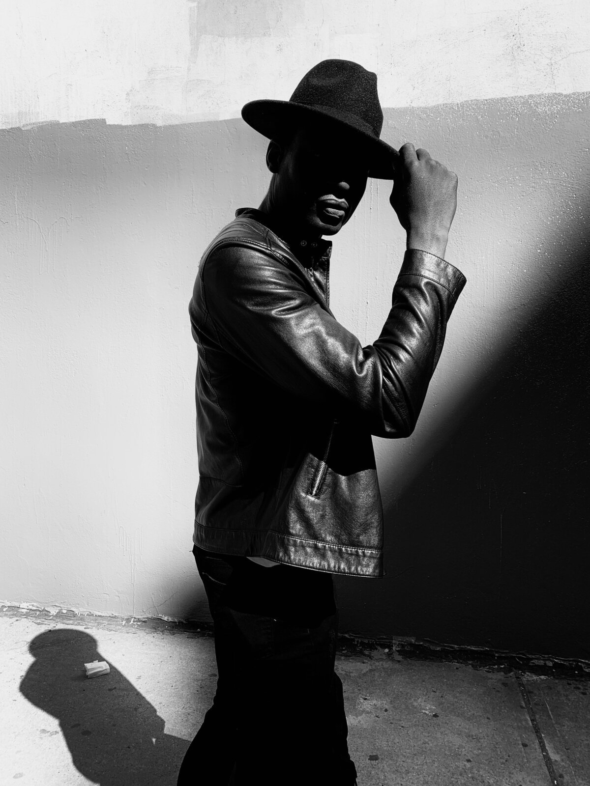 grayscale-photo-of-man-wearing-leather-jacket-3027243