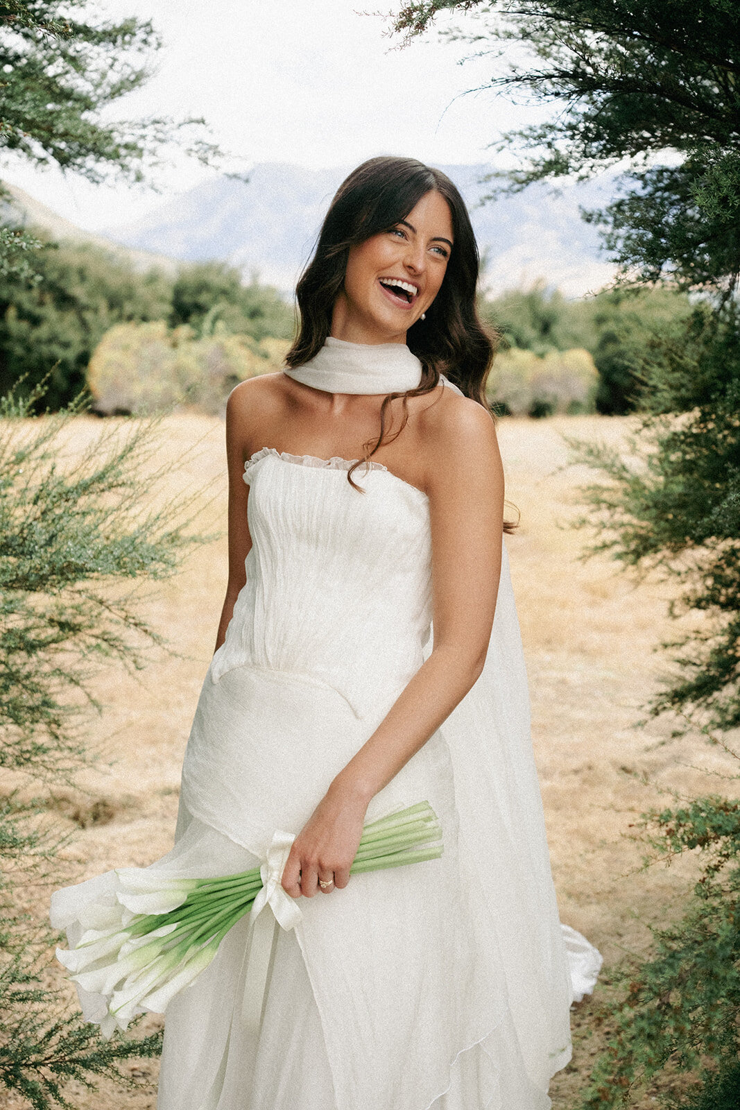 beautifulbrideonherweddingdayinqueenstownwithhairandmakeupnaturalandsoftfrommakeupartistpaigeshipstone11