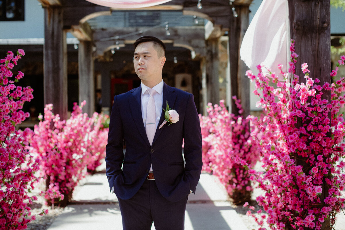 portrait-of-a-groom-with-cherry-blossoms-at-the-wakefield-grand-1