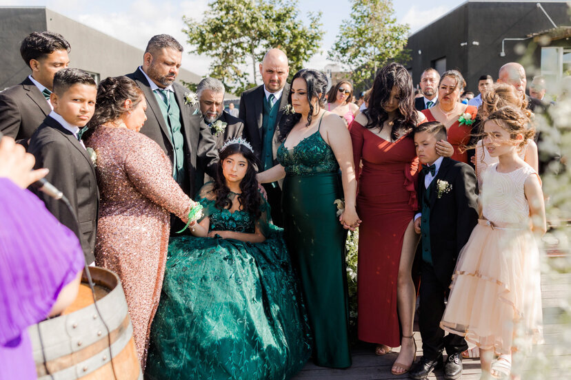 family-praying-quinceanera