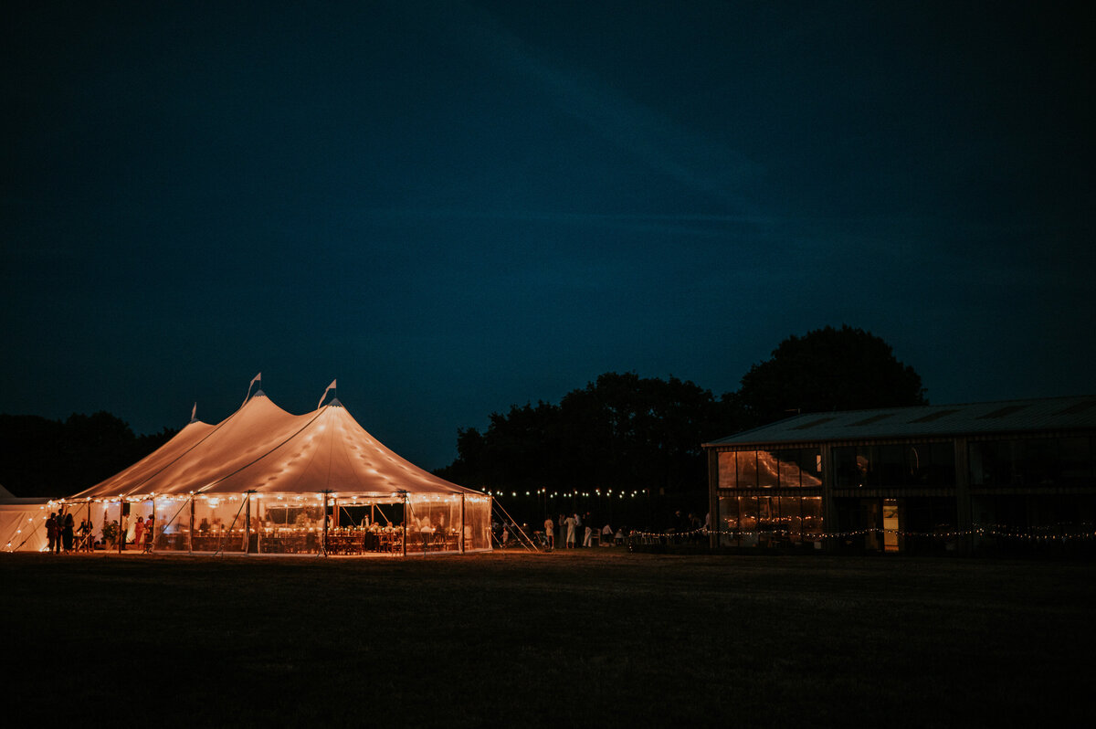 Night shot of outdoor tent wedding