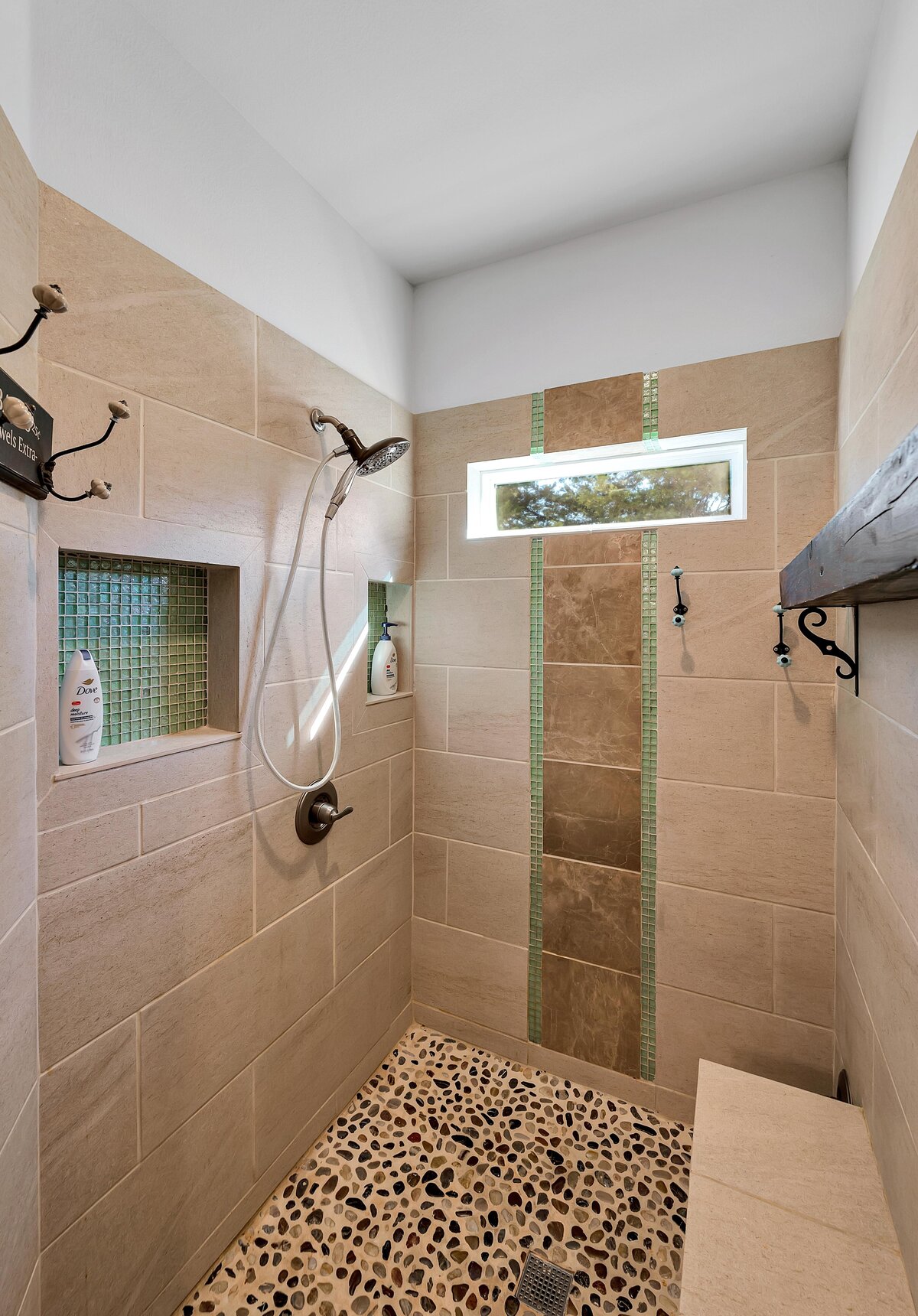 Luxurious tiled walk-in shower in this 7-bedroom, 5-bathroom farmhouse that sleeps 21 on a secluded acreage just 15 minutes from downtown Waco, TX