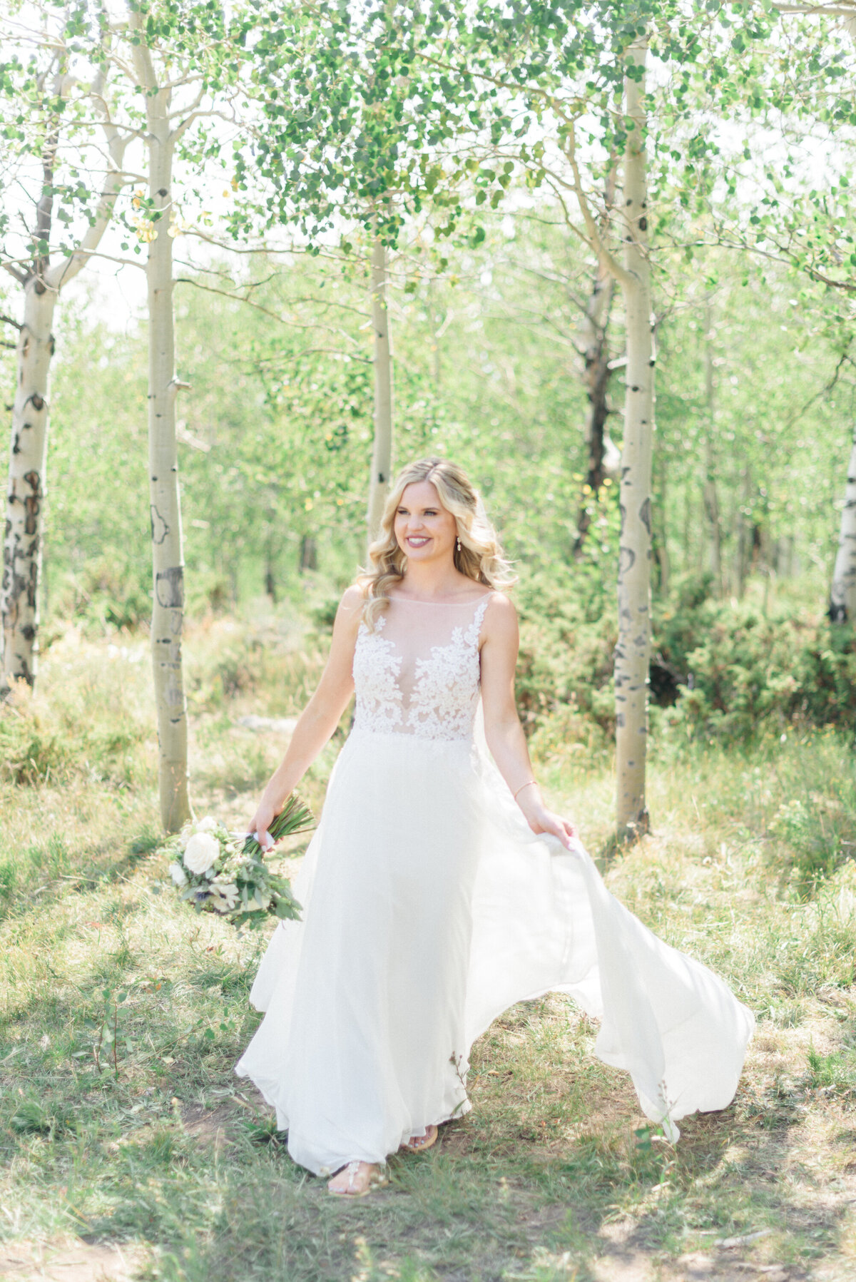 Summer Granby Wedding at the summit. Bridal portraits with aspens and beautiful florals.