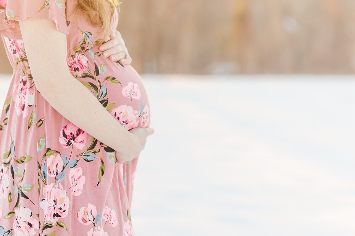 bump in snow during snowy winter maternity photo session with Sara Sniderman Photography in Medfield Massachusetts