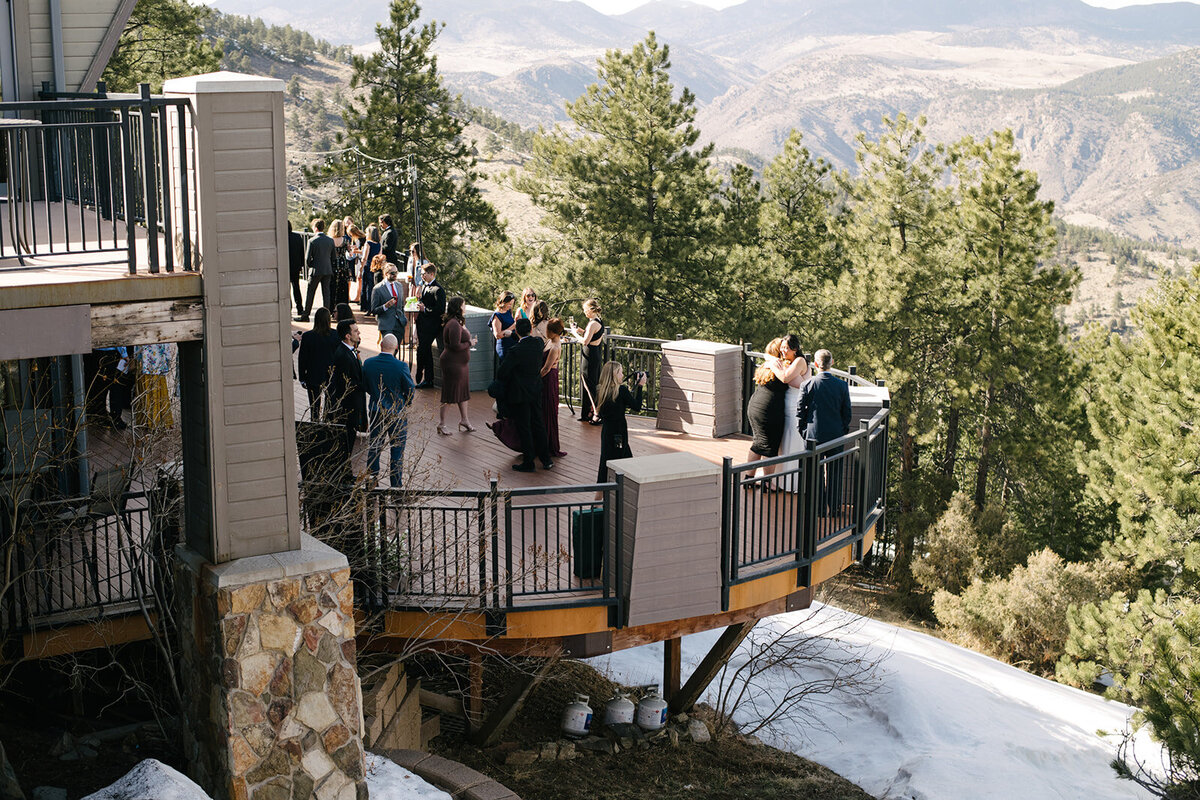 Wedding guests erupting in laughter during the reception, photographed in a natural, storytelling style.