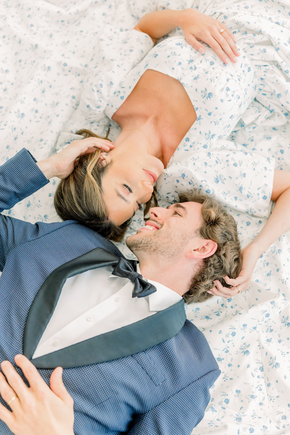 Bride and groom laying down together