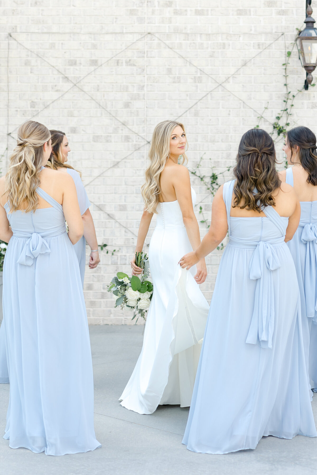 bride and bridesmaids in blue